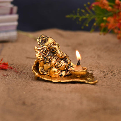 Antique Ganesh Idol on Leaf with Diya