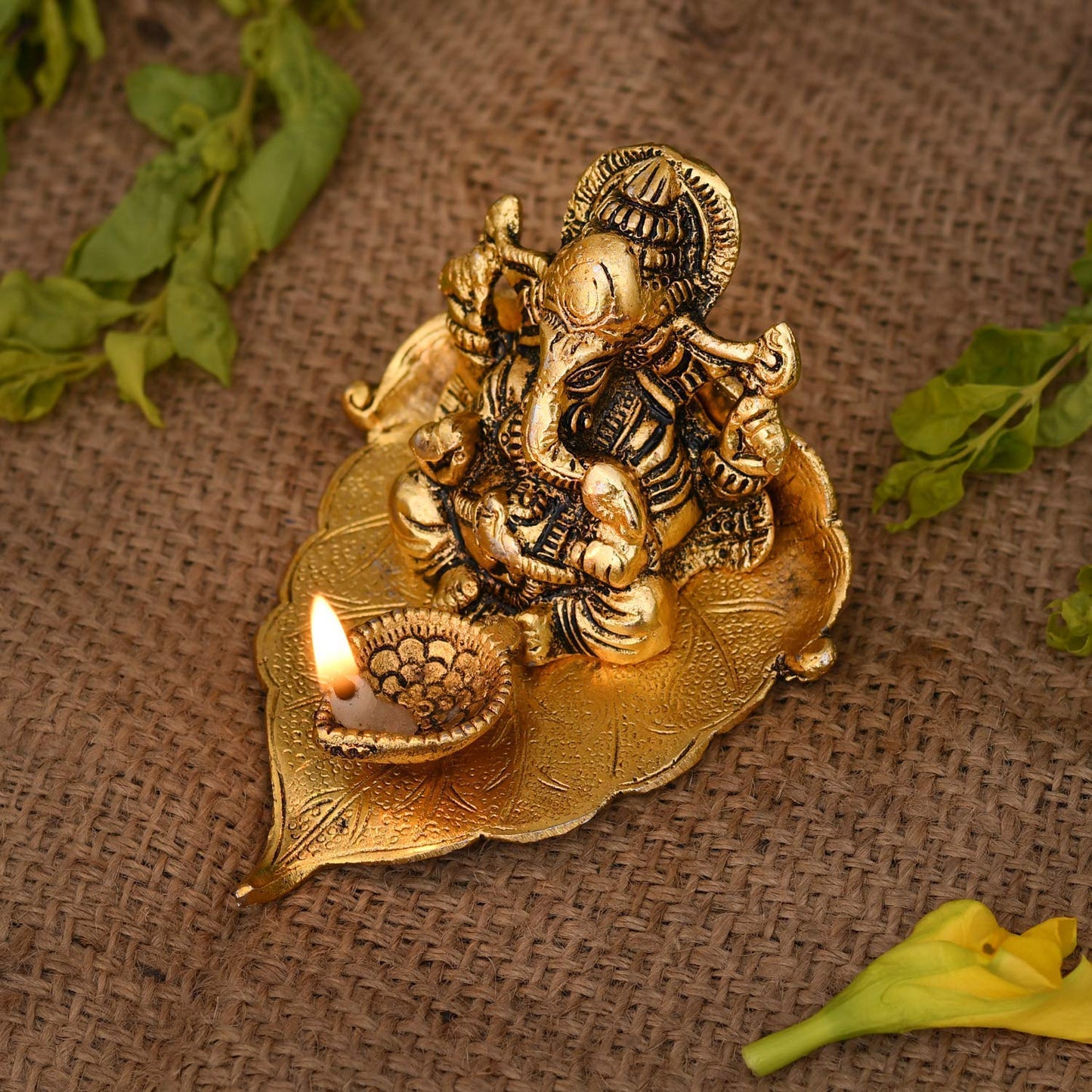 Antique Ganesh Idol on Leaf with Diya